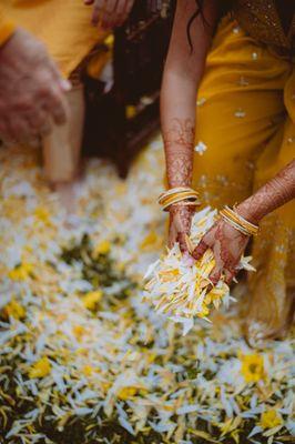 Yellow and white flower petals provided for a flower blessing ceremony