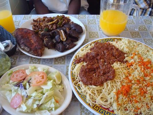 fish, goat, beef, and salad served with spaghetti and rice... a lot of delicious food!