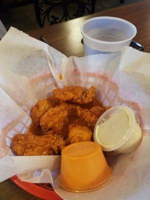 Perfectly cooked boneless wings with awesome sauce