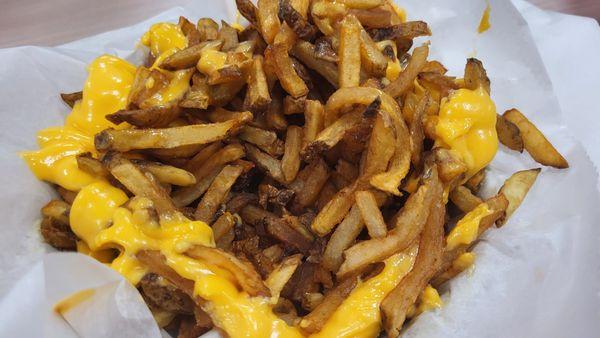 Under the top layer of the cheese fries