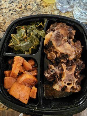 Oxtails, Greens, and candied yams to go. Delicious!