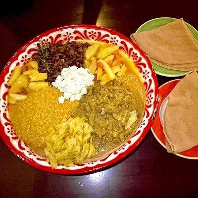 ...And homemade cottage cheese in the center, on the right hand are spongy like crepes called Injera. Soooo delicious!