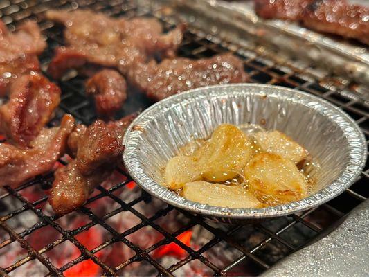 Garlic roasted in sesame oil on the grill.  Proper KBBQ-style ;)