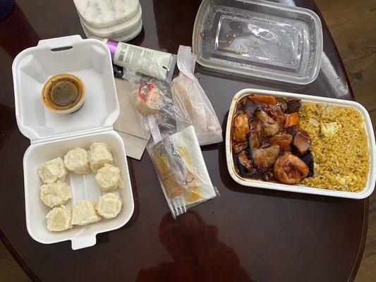 Shrimp Dumplings (Left), Utensils/Napkins/Sauces/Egg roll (Middle), Eggplant & Shrimp w/ fried rice