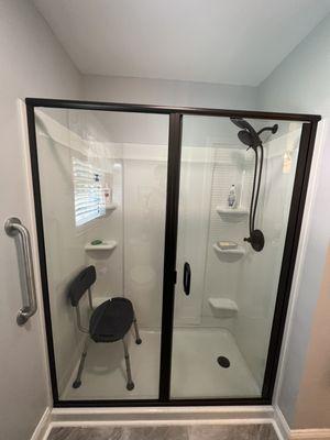 Newly installed walk in shower with glass doors