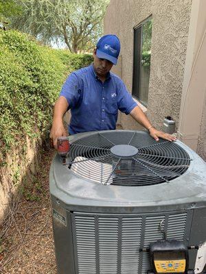 Octavio is diving in to complete a routine maintenance before the ac has to work hard this summer!