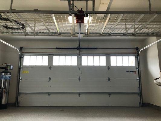 Professional garage door installs, fair prices. Nice storage racks by Absolute Contracting Inc.