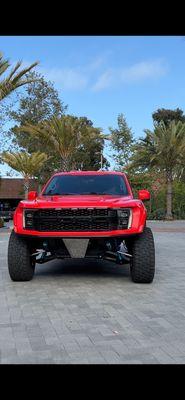 3M high gloss red wrap, black delete grill, Llumar IRX 50 windshield and IRX 15 sides.