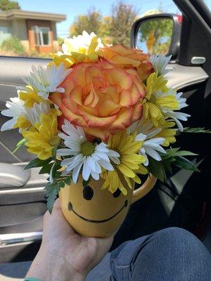 Happy face mug flower arrangement