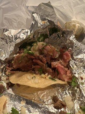 Raw carnitas taco