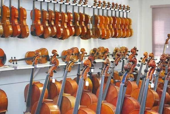 Cellos and violas for sale in our showroom.