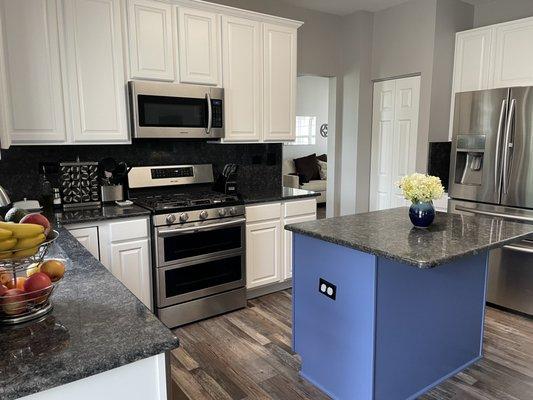 Our refinished cabinets and bifold doors. It's like a new kitchen!