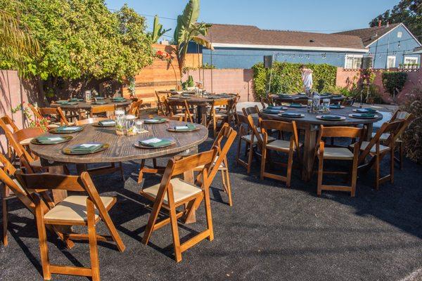 Rustic table and chairs on the pool deck.