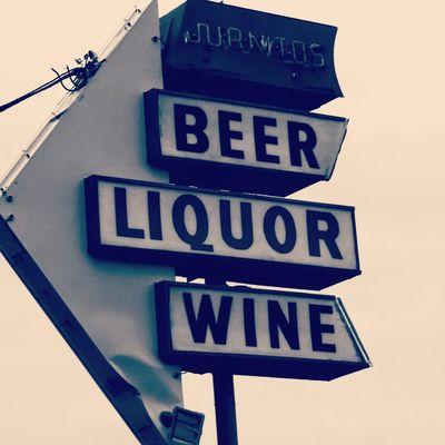 Juanito's Liquor Store  sign.. you know you're home when you see this..