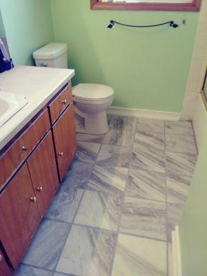 Water damage in my bathroom. Had this new floor put in. Job looks great!