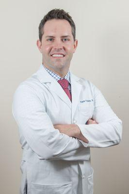 Dr. Frank P. Albino, board-certified plastic surgeon.