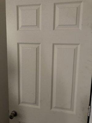 Replacement door, not painted & offline to the one that was damaged and kicked in. There on move in date