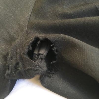 Suit pants ruined! After complaining, they "fixed" this patch with a dark brown one...