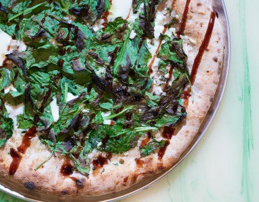 The Spinach - Baby spinach, fresh mozzarella cheese, pecorino romano,
 goat cheese, herbs, and a balsamic reduction.