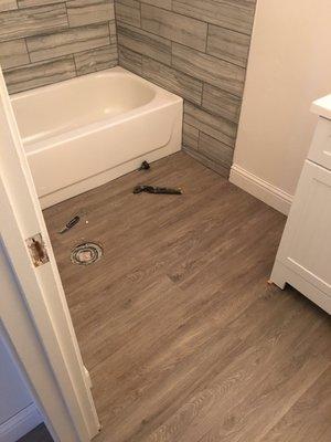 Flooring and bathroom vanity installation