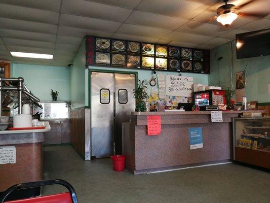 Counter with signs and clutter