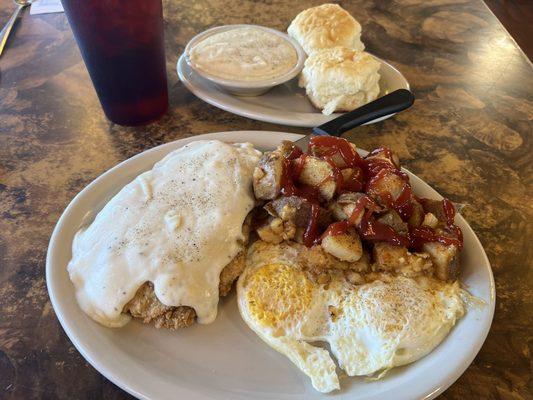 Chicken Fried Steak and gravy, eggs over easy, home fries, & biscuits and gravy