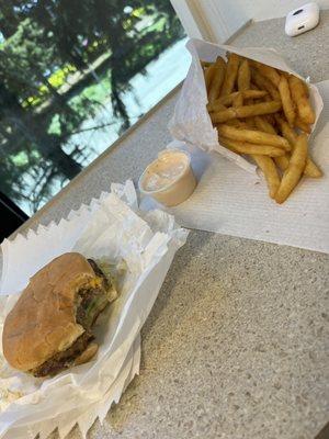 Single patty with cheese, fries and regular fry sauce.