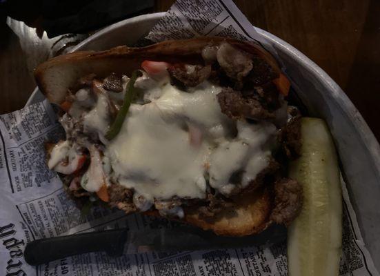 Philly cheesesteak on a pretzel bun