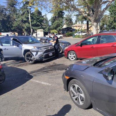 Women drove straight into our parked car at Safeway parking lot.