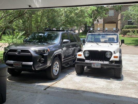 The Jeep is a 1999 parked next to a 2020 4Runner.