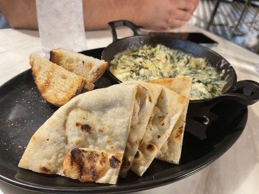 Artichoke spinach dip. Creamy combination with tons of sour dough bread and pita. Great portion for sharing.