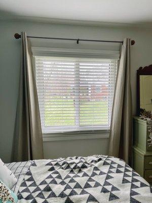 Faux wood blinds.