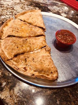 The calzone here takes the folded pizza idea pretty literally