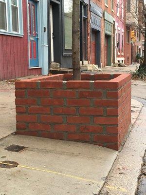 Brick planter on South Street.