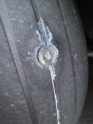 Huge screw and washer into my tire that ruined the sidewalks while driving it to the shop!