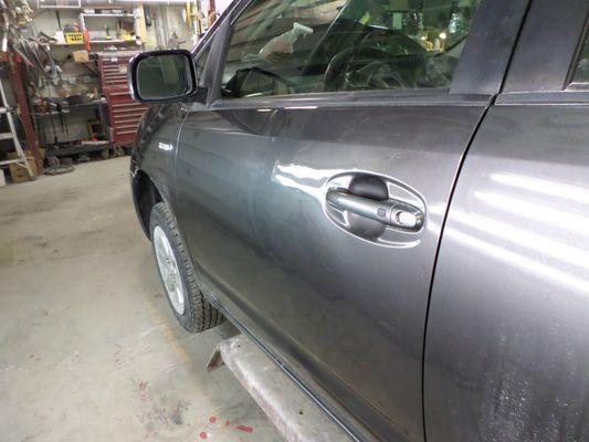 Here is the after pic of that once, large door dent! This is the kind of epxert work we do and have been doing for over 50 years!