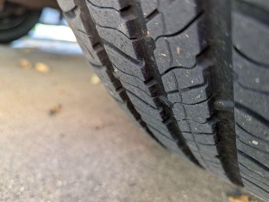 Photo showing tread wear indicator (bar). Discount Tire disingenuously told me I needed 4 new tires due to wear.