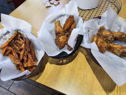 From right to left: sweet potato fries, Old Bay wings, Garlic Parmesan wings