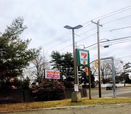 View of signs from 7-11 other side next to building  all on North side of street