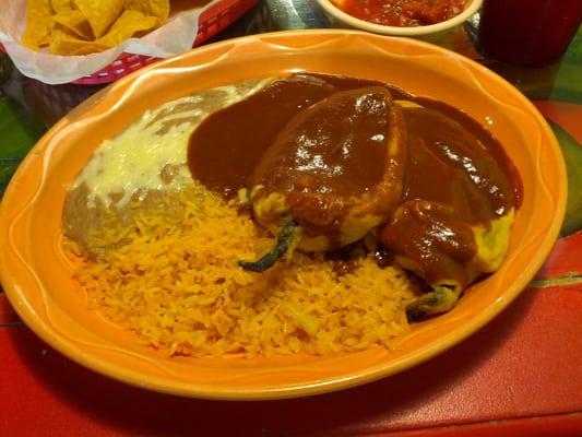 Chile rellenos cold in the center and quite tasteless with overly sauced topping, dry rice pasty refried beans.