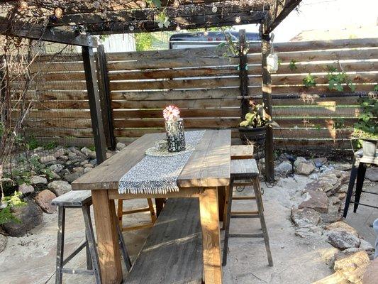 Seating area near the vine wall.