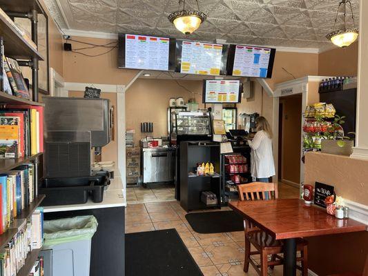 Front counter, seating, drink station.