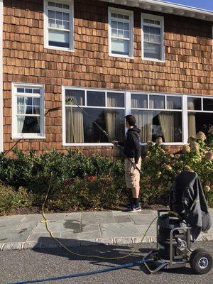 One of our window specialists using the water-fed pole system and doing what we love every day!