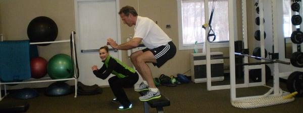 John performing a  vertical broad jump