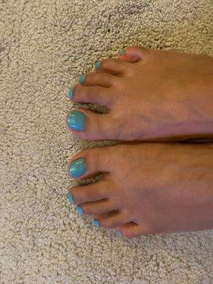 Teal polish on toes