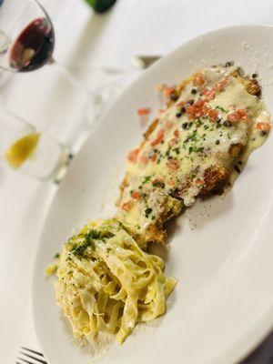 Chicken Milanese  With champagne beurre blanc, served with Fettuccine Alfredo.