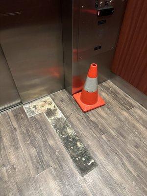 Elevator floor in disarray.