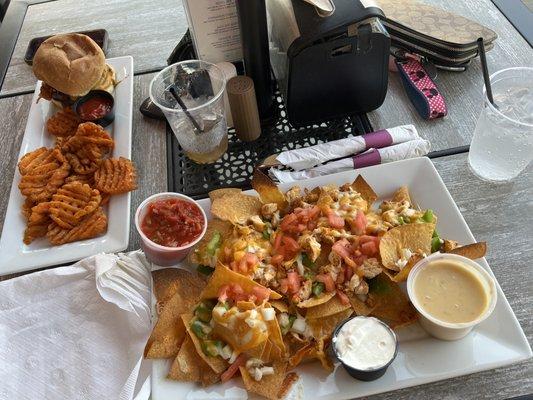 Nachos with chicken Rodeo burger with sweet potato fries