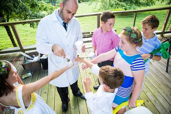 One of Mr. Bond's Science Guys entertaining children at an outdoor wedding.