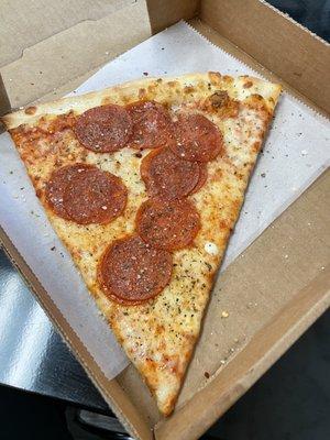 Pepperoni pizza by the slice